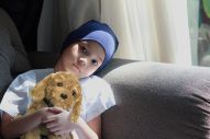 Girl holding elliot on lounge